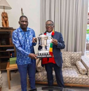 Champions:Scott Sakupwanya presenting the trophy to President Mnangagwa after winning the premier league